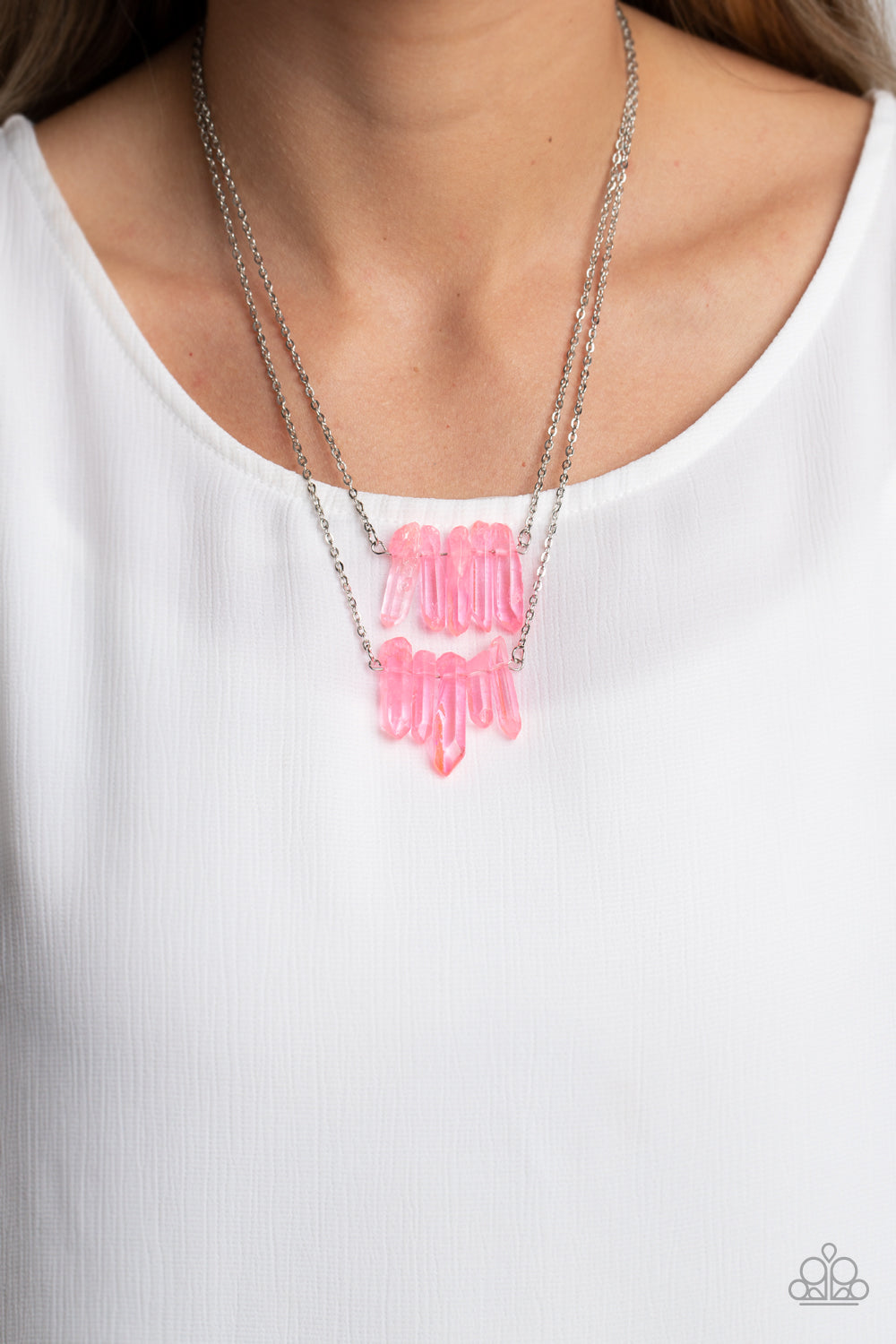 Paparazzi Accessories - Crystal Catwalk - Pink Necklace chiseled into a colorful collection, two layers of transparent pink crystal-like stones swings from the bottom of two dainty silver chains for a handcrafted, artisanal look. Features an adjustable clasp closure. As the stone elements in this piece are natural, some color variation is normal.  Sold as one individual necklace. Includes one pair of matching earrings.