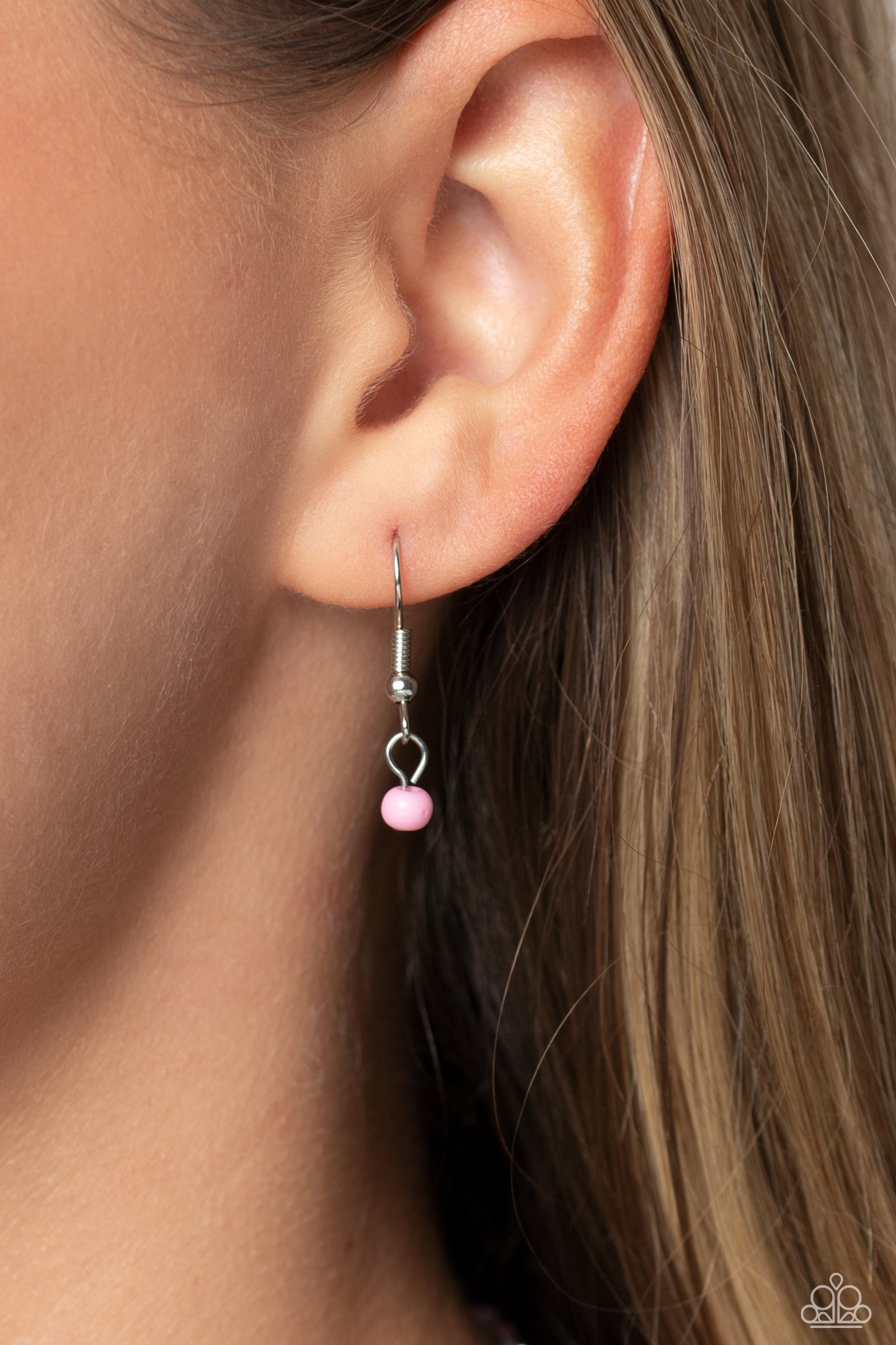 Paparazzi Accessories - High School Reunion - Pink Smiley Necklace Gliding from a dainty, silver chain, a smiley face pendant stands out against a pink backdrop. Completing the charismatic ensemble, a collection of seed beads in shades of light pink, white, pink, orange, and hot pink create bright pops of color around the neckline for a youthful finish. Features an adjustable clasp closure. Sold as one individual necklace. Includes one pair of matching earrings.