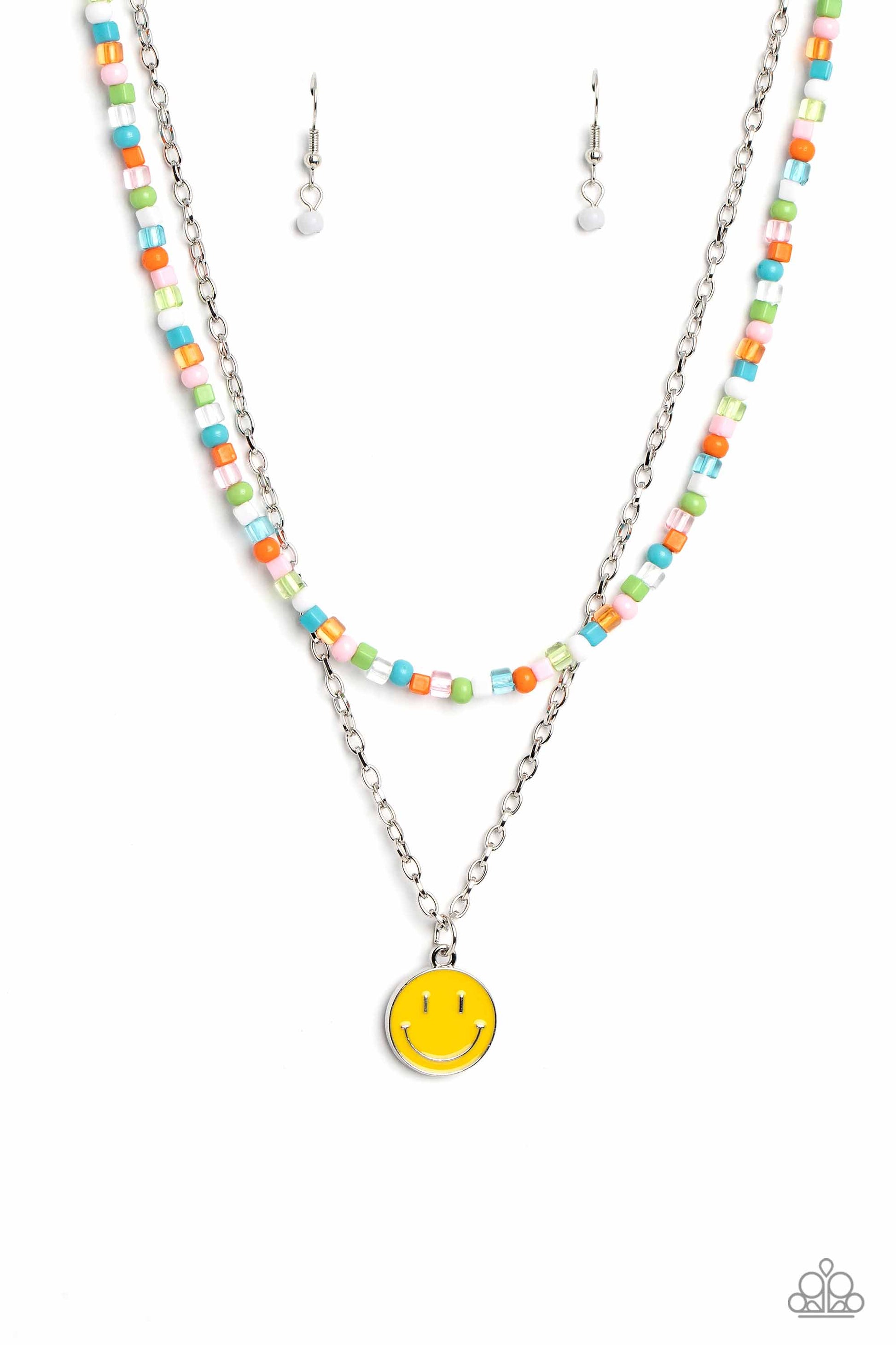 Paparazzi Accessories - High School Reunion - Multi Necklaces gliding from a dainty, silver chain, a smiley face pendant stands out against a yellow backdrop. Completing the charismatic ensemble, a collection of seed beads in shades of baby pink, apple green, white, orange, and turquoise create bright pops of color around the neckline for a youthful finish. Features an adjustable clasp closure.  Sold as one individual necklace. Includes one pair of matching earrings.