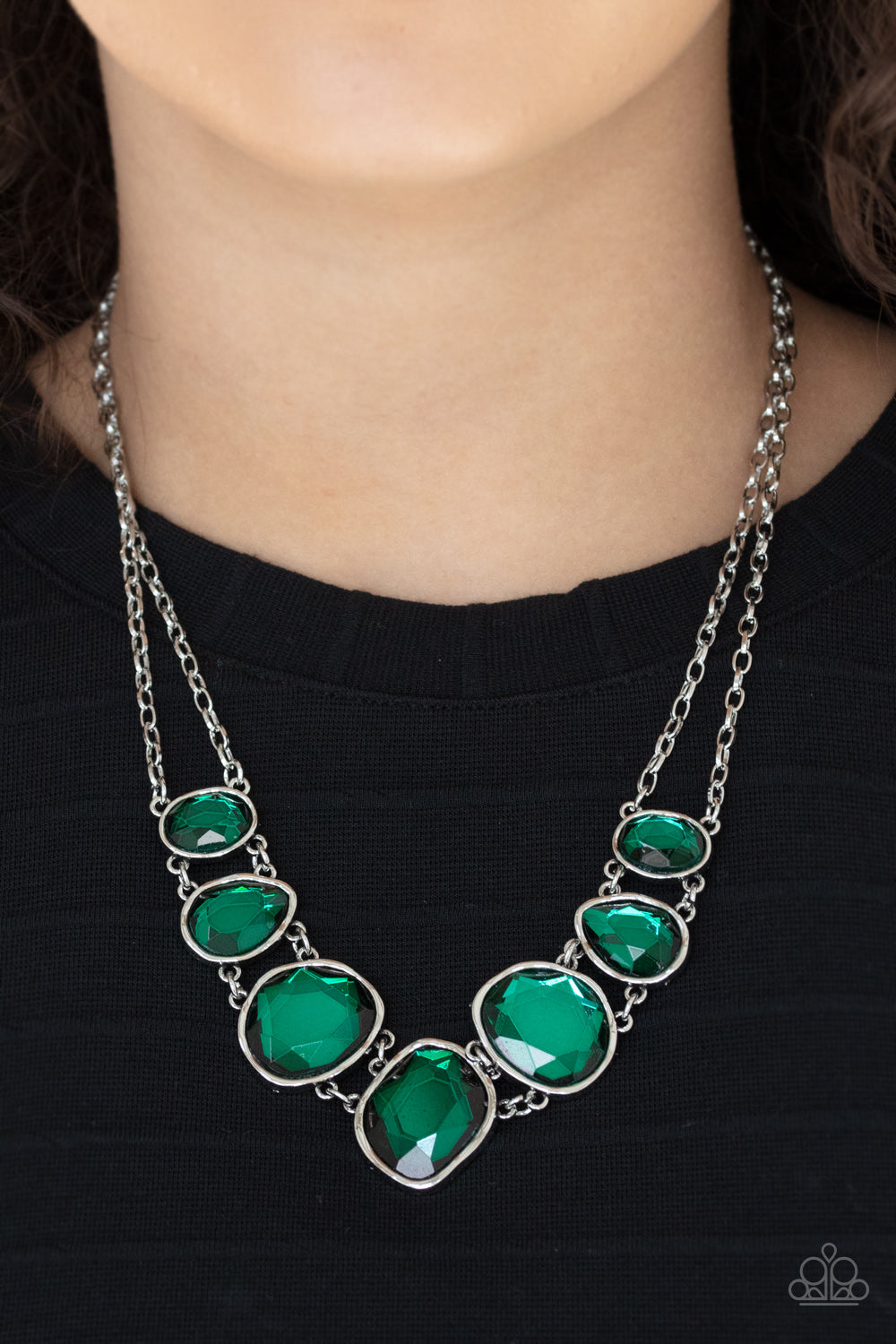 Absolute Admiration - Green Rhinestone Necklaces encased in hammered asymmetrical silver frames, an imperfect collection of faceted green gems are suspended from two shimmery silver chains as they double-link below the collar for a dramatic effect. Features an adjustable clasp closure. Sold as one individual necklace. Includes one pair of matching earrings.
