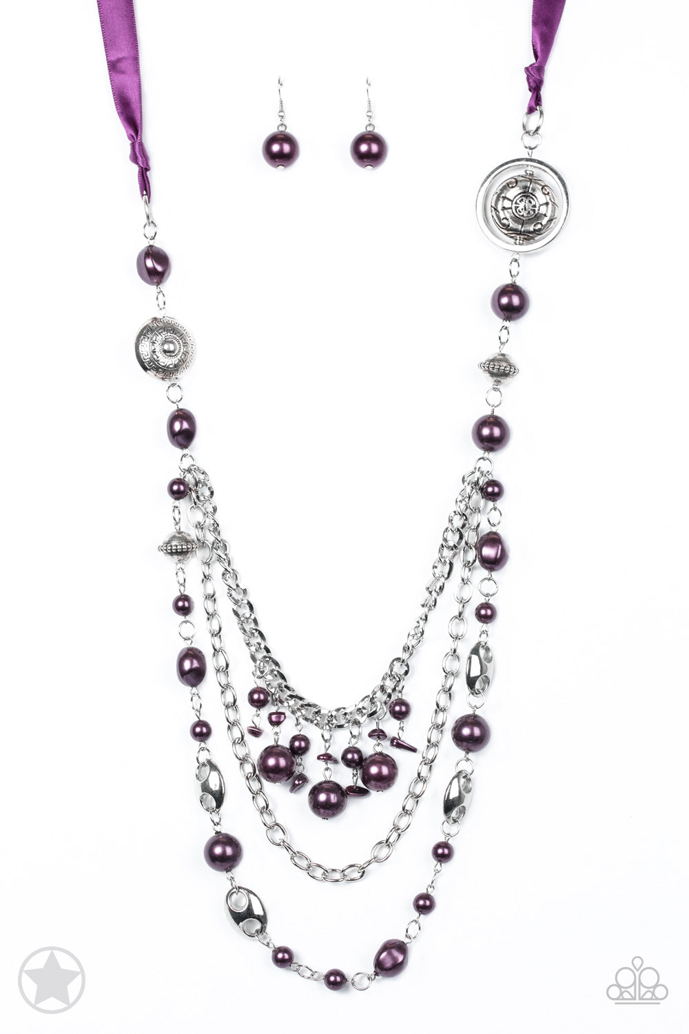 Paparazzi Accessories All the Trimmings - Purple Necklaces a silky purple ribbon replaces a traditional chain to create a timeless look. Pearly deep purple beads and funky silver pieces intermix with varying lengths of silver chains to give a fresh take on a Victorian-inspired piece.