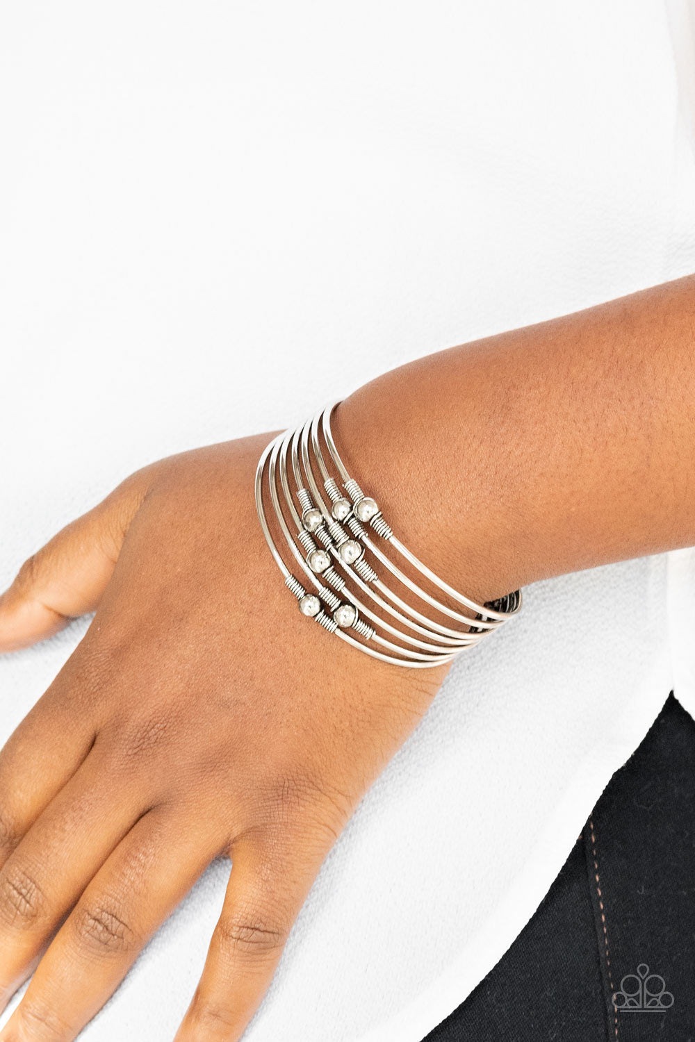 Industrial Intricacies - Silver Cuff Bracelets held in place by silver wire fittings, classic silver beads haphazardly dot dainty silver bars that connect into a layered cuff around the wrist. Sold as one individual bracelet.