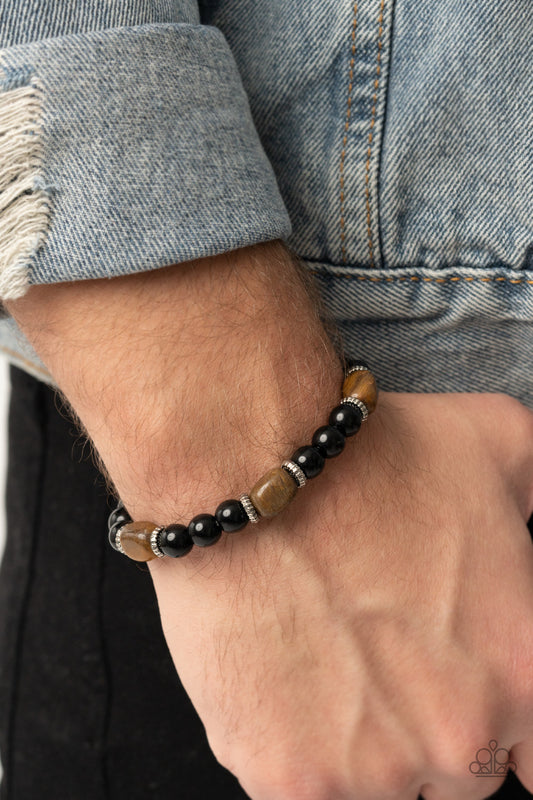 Unity - Brown Tiger's Eye Urban Stretch Bracelets infused with dainty silver accents, glassy black and tiger's eye stone beads are threaded along a stretchy band around the wrist for a stackable seasonal look.  Sold as one individual bracelet.  Paparazzi Jewelry is lead and nickel free so it's perfect for sensitive skin too!