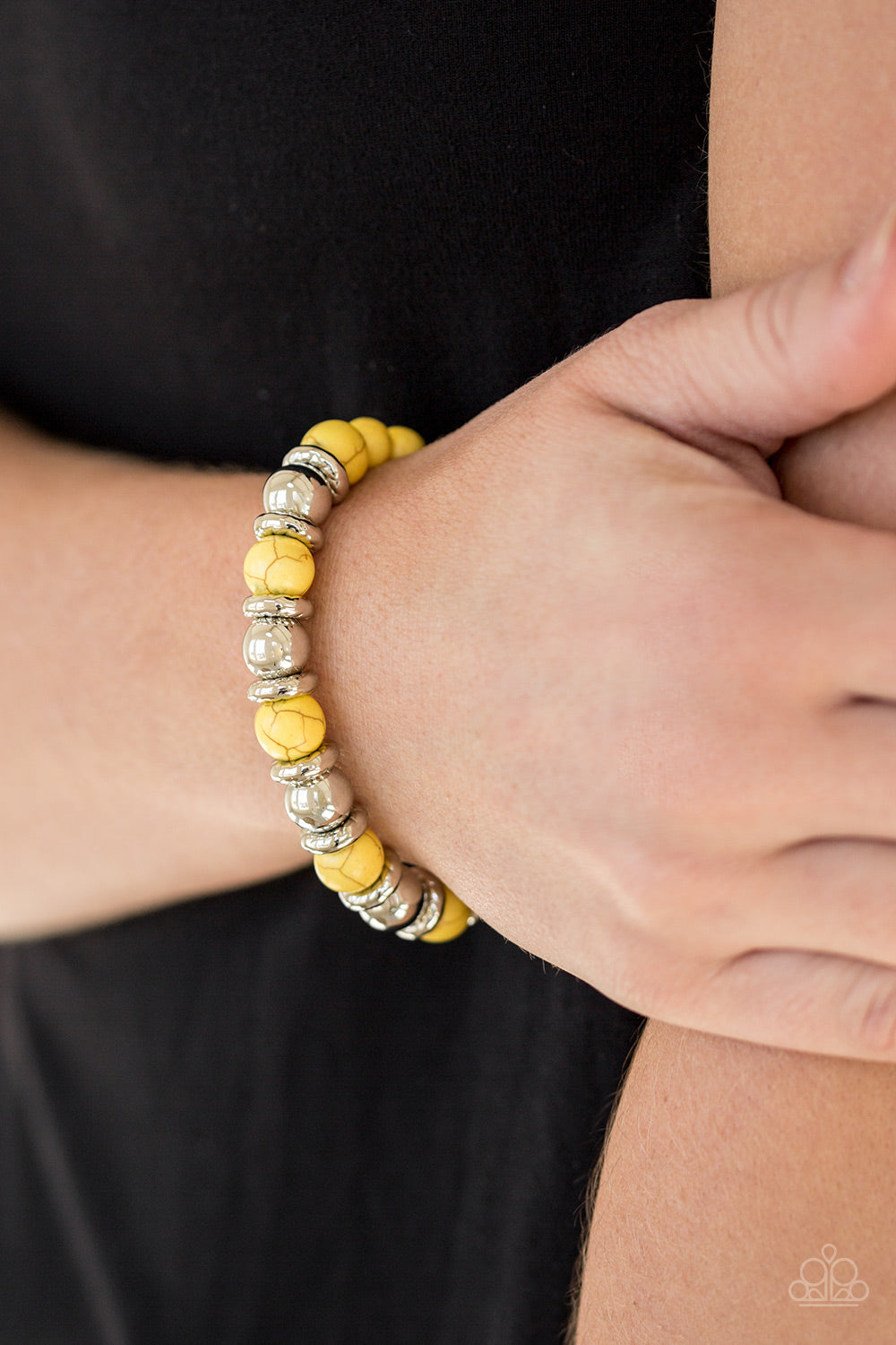 Paparazzi Accessories Across the Mesa - Yellow Bracelets a collection of silver accents and sunny yellow stones are threaded along a stretchy band for a seasonal look. Sold as one individual bracelet.