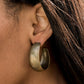 Paparazzi Accessories - Etched in gritty linear patterns, thick brass hoops boldly curl around the ear for a statement-making finish. Earring attaches to a standard post fitting. Hoop measures approximately 1 1/4” in diameter.  Sold as one pair of hoop earrings.