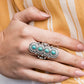 Radiating with antiqued circular frames, a row of dainty turquoise stones climb the finger dramatically for a statement-making finish. Features a stretchy band for a flexible fit.  Sold as one individual ring.