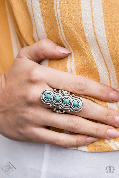 Radiating with antiqued circular frames, a row of dainty turquoise stones climb the finger dramatically for a statement-making finish. Features a stretchy band for a flexible fit.  Sold as one individual ring.