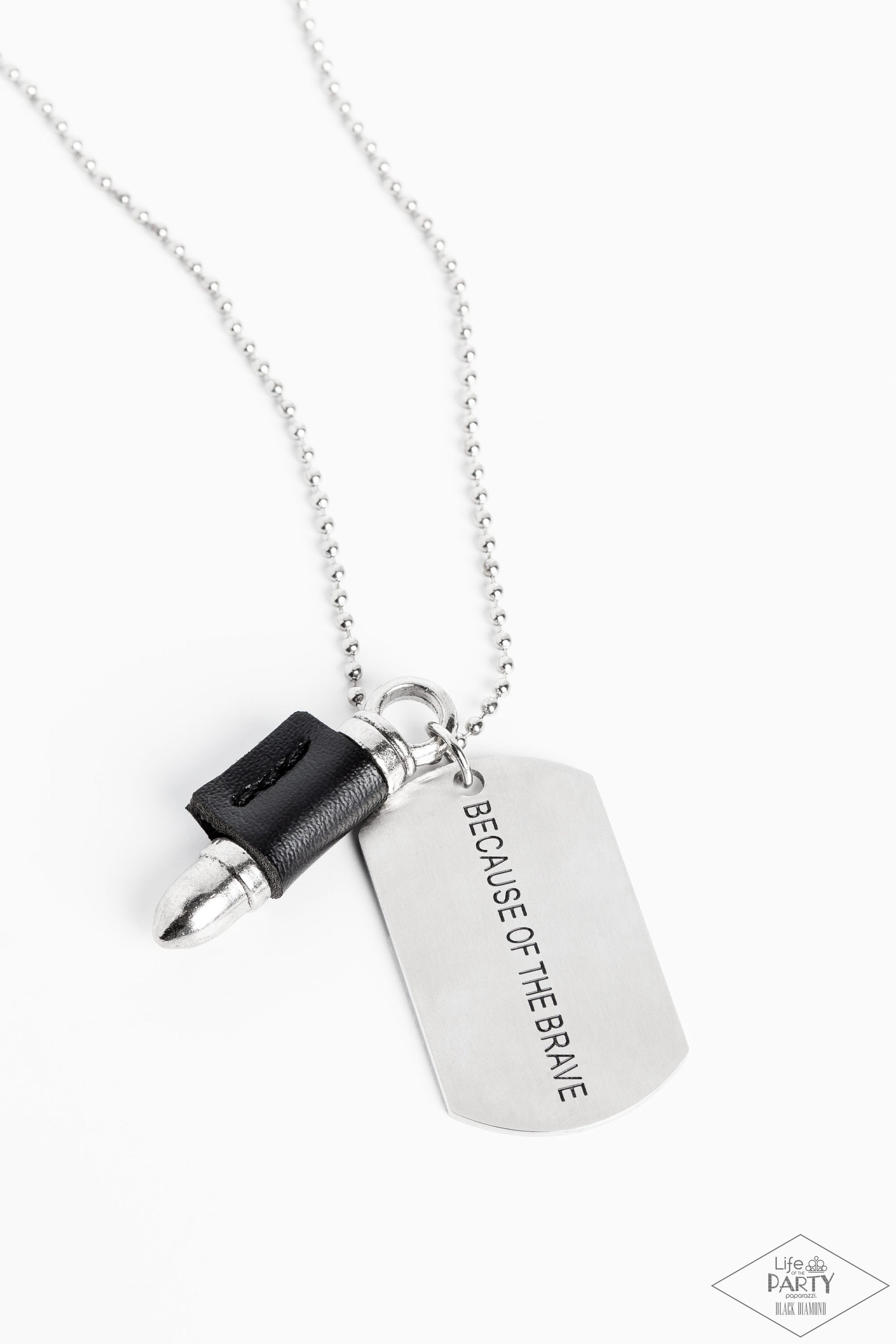 Paparazzi Accessories - Proud Patriot - Black Urban Necklace pinched between a black leather fitting, a silver bullet pendant joins a silver dog tag at the bottom of a silver ball chain. The shimmery dog tag is stamped in the phrase, "Because of the Brave," for a patriotic finish. Features a ball and clasp closure.  Sold as one individual necklace.