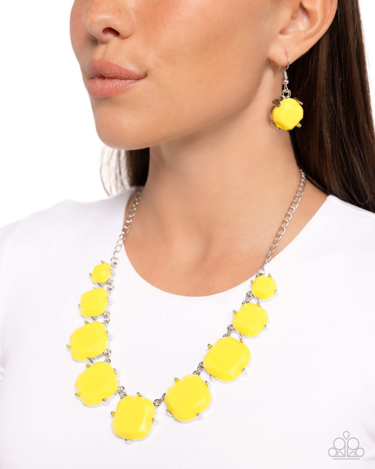 Encased in pronged silver fittings, faceted Illuminating beads gradually increase in size as they link below the collar, creating a flamboyant pop of color. Features an adjustable clasp closure.  Sold as one individual necklace. Includes one pair of matching earrings.