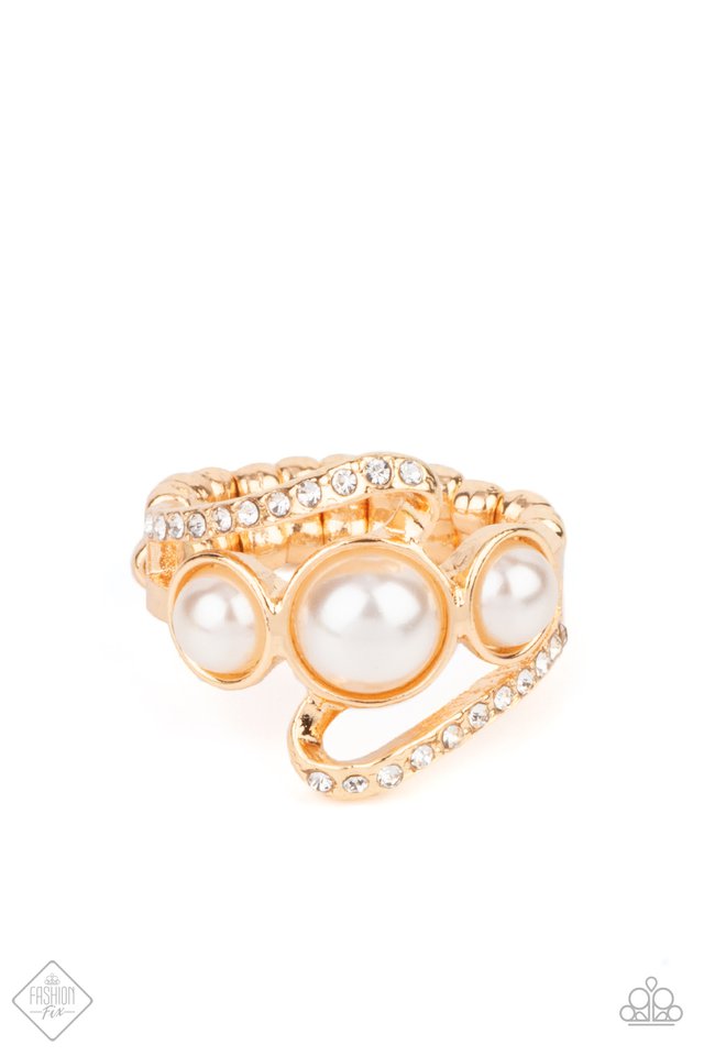 A golden ribbon of&nbsp;white&nbsp;rhinestones whirls around and behind a single band of three bubbly white pearls, coalescing into a timeless twinkle atop the finger. Features a dainty stretchy band for a flexible fit.  Fiercely 5th Avenue August 2021