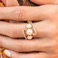 A golden ribbon of&nbsp;white&nbsp;rhinestones whirls around and behind a single band of three bubbly white pearls, coalescing into a timeless twinkle atop the finger. Features a dainty stretchy band for a flexible fit.  Fiercely 5th Avenue August 2021