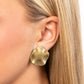 Featuring a high sheen finish, wavy brass discs are hammered and molded into a rustic industrial statement. Earring attaches to a standard clip-on fitting.  Sold as one pair of clip-on earrings.