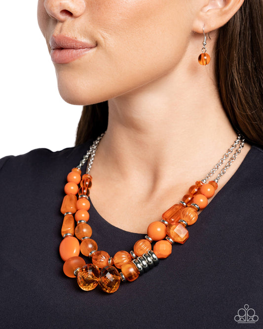 <p data-mce-fragment="1">Paparazzi Accessories - Pina Colada Paradise - Orange Necklaces barying in shape, size, and opacity, a refreshing collection of orange acrylic and crystal-like beads join silver discs along invisible wires that flawlessly layer below the collar for a vivacious pop of color. Features an adjustable clasp closure.</p> <p data-mce-fragment="1"><i data-mce-fragment="1">Sold as one individual necklace. Includes one pair of matching earrings.</i></p>