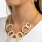Paparazzi Accessories - Uptown Links - Gold Necklaces a shiny collection of flat gold rings in varying sizes and brushed in a brilliant gold shimmer, link together below the collar. The assortment of gold rings attaches to a bright gold chain for a dazzling finish. Features an adjustable clasp closure.  Sold as one individual necklace. Includes one pair of matching earrings.