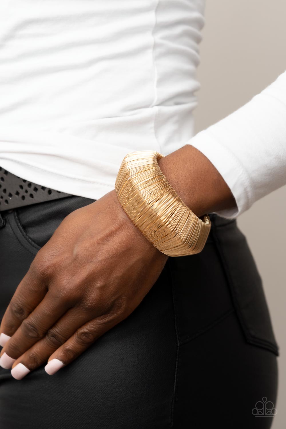 Paparazzi Accessories - Wild About Wire - Gold Bracelets layer after layer of glistening gold wire wraps around an oversized gold cuff. The center of the wire wrap comes to a peak, adding edge to the intense industrial display.  Sold as one individual bracelet.