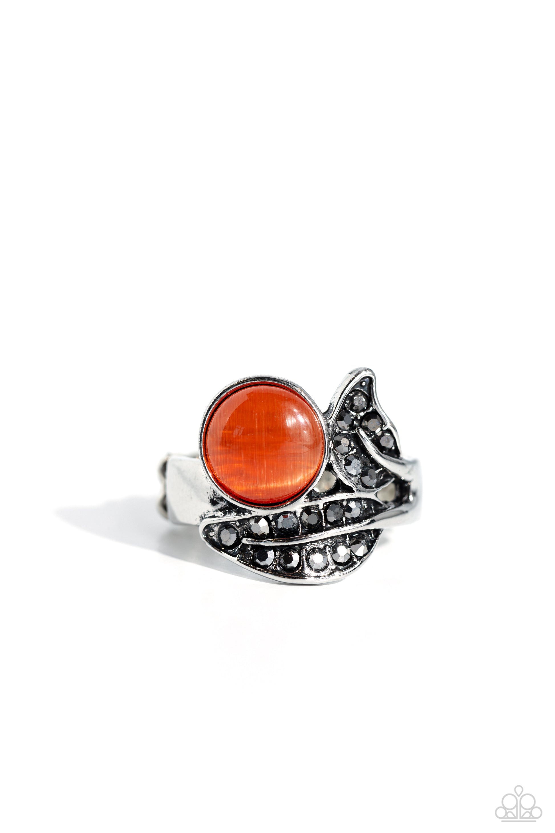 Paparazzi Accessories - Cats Eye Candy - Orange Rings hematite rhinestone encrusted silver leaf frames delicately gather around a dreamy orange cat's eye stone, resulting in an ethereal centerpiece atop the finger. Features a dainty stretchy band for a flexible fit.  Featured inside The Preview at Made for More!  Sold as one individual ring.