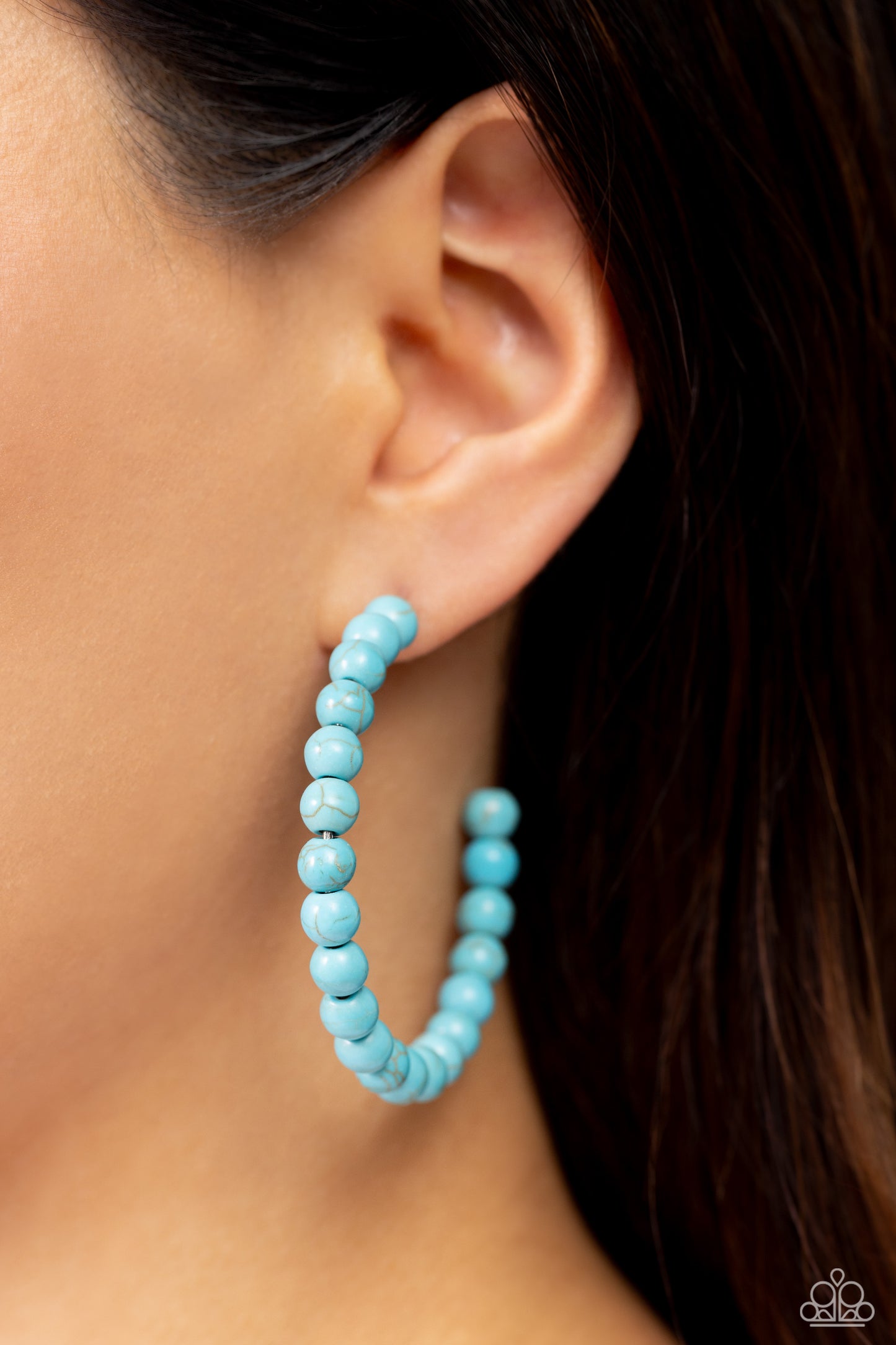 Paparazzi Accessories - Rural Retrograde - Blue Hoop Earrings refreshing turquoise stone beads are threaded along a dainty wire hoop, resulting in an earthy flair. Earring attaches to a standard post fitting. Hoop measures approximately 2" in diameter. Sold as one pair of hoop earrings.