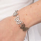 Featuring airy stenciled cutouts, three silver butterflies delicately connect at the center of a silver box chain for a whimsical fashion. Features an adjustable sliding bead closure.  Sold as one individual bracelet.