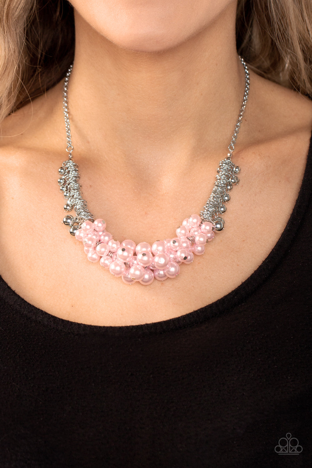 Paparazzi Accessories - Bonus Points - Pink Pearl Necklace a bubbly cluster of Gossamer Pink pearls are bunched together between hanging silver beads that dangle between jampacked rows of silver rings, resulting in exaggerated effervescence below the collar. Features an adjustable clasp closure.  Sold as one individual necklace. Includes one pair of matching earrings.