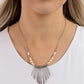 Paparazzi Accessories - CLAWS of Nature - White Necklaces hammered in a dotted motif, a dainty row of silver rods shimmers along an invisible wire dotted in dainty silver and white stone beads. Attached to a dainty silver chain, the tapered fringe flares out below the collar, resulting in an earthy edge. Features an adjustable clasp closure.  Sold as one individual necklace. Includes one pair of matching earrings.