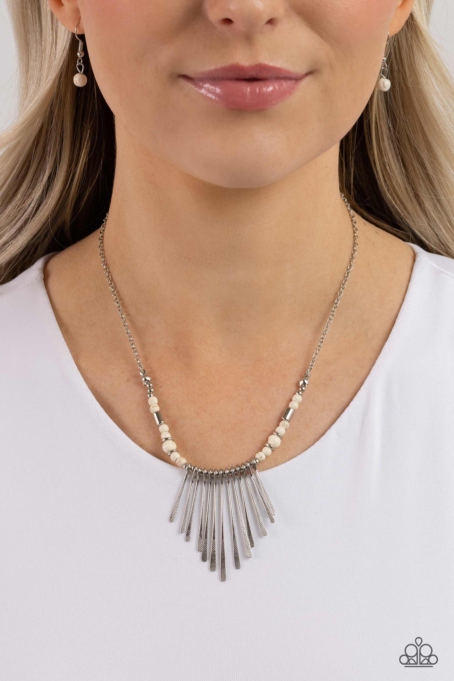 Paparazzi Accessories - CLAWS of Nature - White Necklaces hammered in a dotted motif, a dainty row of silver rods shimmers along an invisible wire dotted in dainty silver and white stone beads. Attached to a dainty silver chain, the tapered fringe flares out below the collar, resulting in an earthy edge. Features an adjustable clasp closure.  Sold as one individual necklace. Includes one pair of matching earrings.