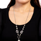 Paparazzi Accessories - Sagebrush Sanctuary - White Necklaces dainty white stone beads link with hammered silver accents at the bottom of lengthened silver chains. The earthy display gives way to an oversized white stone teardrop that swings from a twisted silver hoop, resulting in an artisan inspired pendant. Features an adjustable clasp closure.  Sold as one individual necklace. Includes one pair of matching earrings.