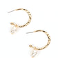 Paparazzi Accessories - Glam Overboard - Gold Hoop Earrings an imperfect white pearl glides along a hammered gold hoop, creating a timeless twist. Earring attaches to a standard post fitting. Hoop measures approximately 1" in diameter.  Sold as one pair of hoop earrings. 