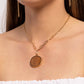 Paparazzi Accessories - WOODnt Dream of It - Gold Necklaces a circular piece of wood is nestled inside a simple gold fitting along a mismatched gold chain, creating an earthy pendant below the collar. Features an adjustable clasp closure.  Sold as one individual necklace. Includes one pair of matching earrings.