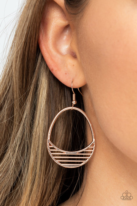 Paparazzi Accessories - Segmented Shimmer - Rose Gold Earrings layers of shiny rose gold bars create shafts of light at the bottom of an airy oval frame, creating segments of shimmer. Earring attaches to a standard fishhook fitting.  Sold as one pair of earrings.