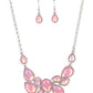 Paparazzi Accessories - Keeps GLOWING and GLOWING - Pink Necklaces a cascade of glassy opalescent pink teardrops are encased in studded silver frames, ultimately clustering below the collar to create an enchanting pop of color. Features an adjustable clasp closure.  Sold as one individual necklace. Includes one pair of matching earrings.