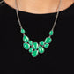 Paparazzi Accessories - Keeps GLOWING and GLOWING - Green Necklaces a cascade of glassy green teardrops are encased in studded silver frames, ultimately clustering below the collar to create an enchanting pop of color. Features an adjustable clasp closure.  Sold as one individual necklace. Includes one pair of matching earrings.