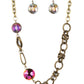 Paparazzi Accessories - Celestially Celtic - Brass Necklaces thick links of brass twist into Celtic knot-like details, linking together with textured brass hoops along the collar. A pair of faceted, saucer-shaped crystal beads, dipped in a reflective oil spill coating and bordered by brass frames, are added to the eclectic display, bringing a hint of colorful shimmer to the design. Features an adjustable clasp closure. Due to its prismatic palette, color may vary. Sold as one individual necklace.