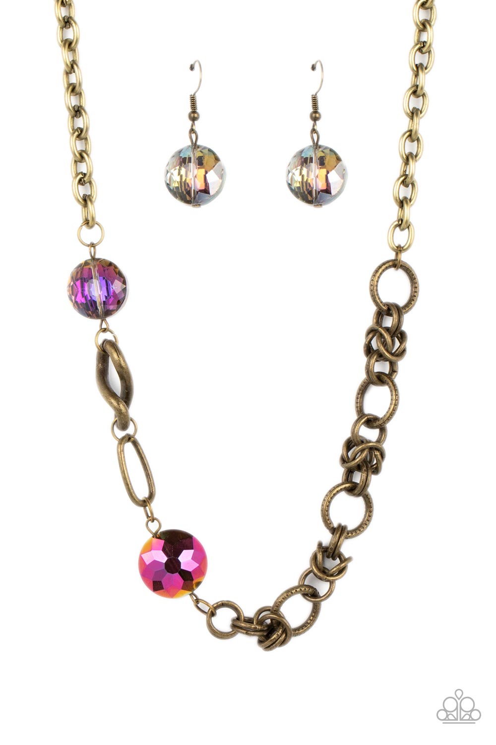 Paparazzi Accessories - Celestially Celtic - Brass Necklaces thick links of brass twist into Celtic knot-like details, linking together with textured brass hoops along the collar. A pair of faceted, saucer-shaped crystal beads, dipped in a reflective oil spill coating and bordered by brass frames, are added to the eclectic display, bringing a hint of colorful shimmer to the design. Features an adjustable clasp closure. Due to its prismatic palette, color may vary. Sold as one individual necklace.