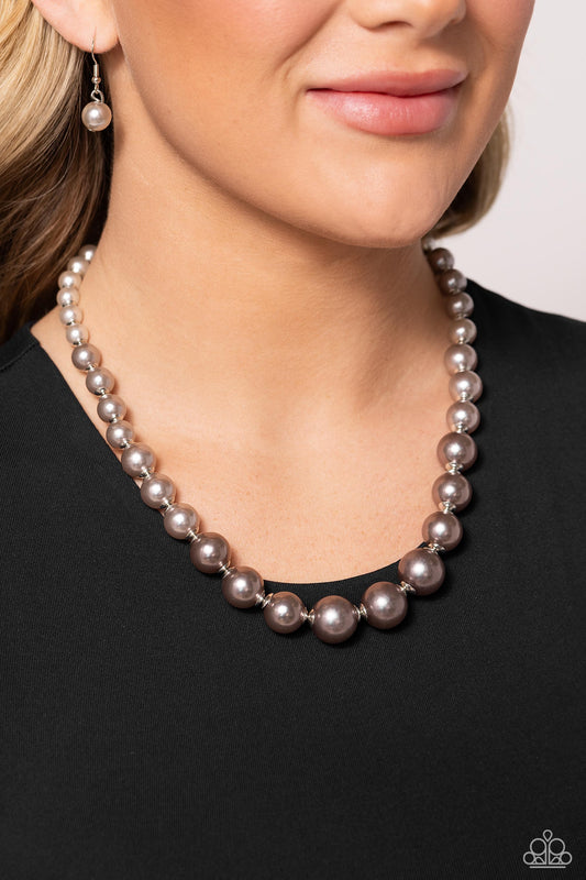 Paparazzi Accessories - Manhattan Mogul - Silver Necklaces a single strand of white, silver, and dark gray pearls elegantly cascades below the collar, creating a glamorous ombre effect. Features an adjustable clasp closure.   Sold as one individual necklace. Includes one pair of matching earrings.