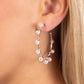 Paparazzi Accessories - Night at The Gala - White Pearl Earrings a classy collection of dainty white pearls are wrapped along the outside curve of a shiny, silver hoop by shimmery silver wire for a handcrafted, posh finish. Earring attaches to a standard post fitting. Hoop measures approximately 1 1/4" in diameter.  Sold as one pair of hoop earrings.