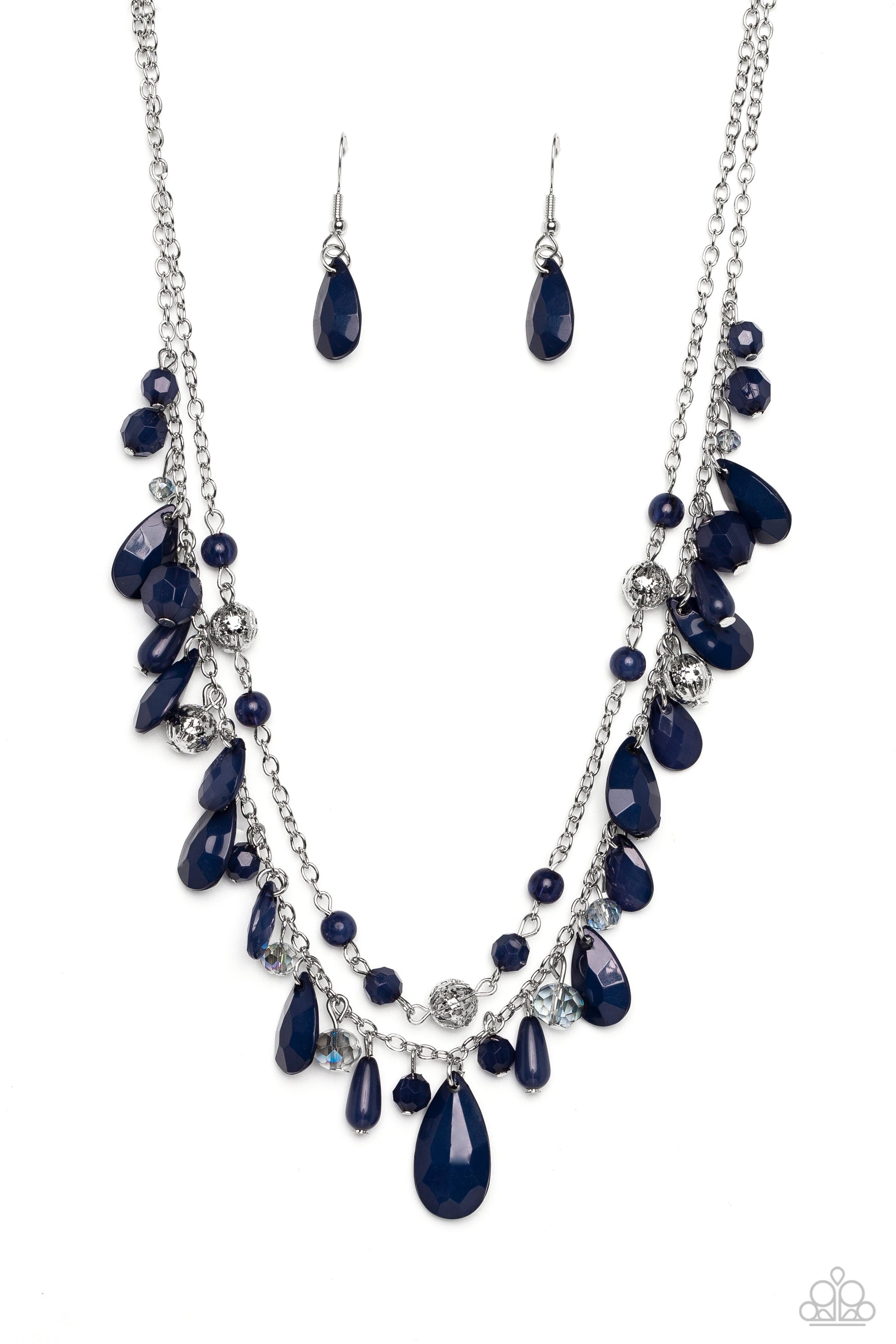 boisterous collection of blue teardrop and round beads, textured silver accents, and faceted blue crystal-like beads trickle from a double strand of silver chain, resulting in flirtatious layers down the neckline. Features an adjustable clasp closure. A dainty collection of blue teardrop and round beads, textured silver accents, and faceted blue crystal-like beads trickle from a single strand of silver chain, resulting in a cheekily clustered chandelier. Earring attaches to a standard fishhook fitting.