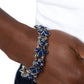 Paparazzi Accessories - Teasing Torrent - Blue Bracelets a flourishing collection of Midnight round, and teardrop beads coalesce into abstract floral-inspired frames. Separating each floral frame, airy, silver-studded beads are infused along elastic stretchy bands, creating a dash of shimmer to the whimsically colorful design around the wrist.  Sold as one individual bracelet.