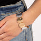 Paparazzi Accessories - Rippling Record - Multi Bracelets a hammered collection of asymmetrical silver and gold discs are threaded along stretchy bands around the wrist for a refined flair. The silver discs feature a rippling hammered effect, while the gold discs feature a more subtle hammered effect, creating a fashionable contrast amidst the different colors.  Sold as one individual bracelet.
