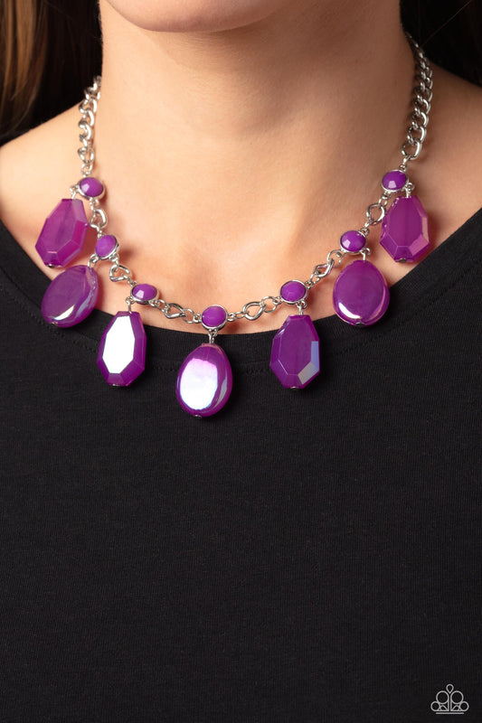 Paparazzi Accessories - Maldives Mural - Purple Necklaces an collection of chiseled, clear and milky geometric shapes in purple hues feature an oil spill overlay as they cascade from a silver curb chain, resulting in a bubbly and boisterous fringe below the collar. A layer of faceted milky purple beads are infused along the silver chain for an additional pop of color. Features an adjustable clasp closure.  Sold as one individual necklace. Includes one pair of matching earrings.