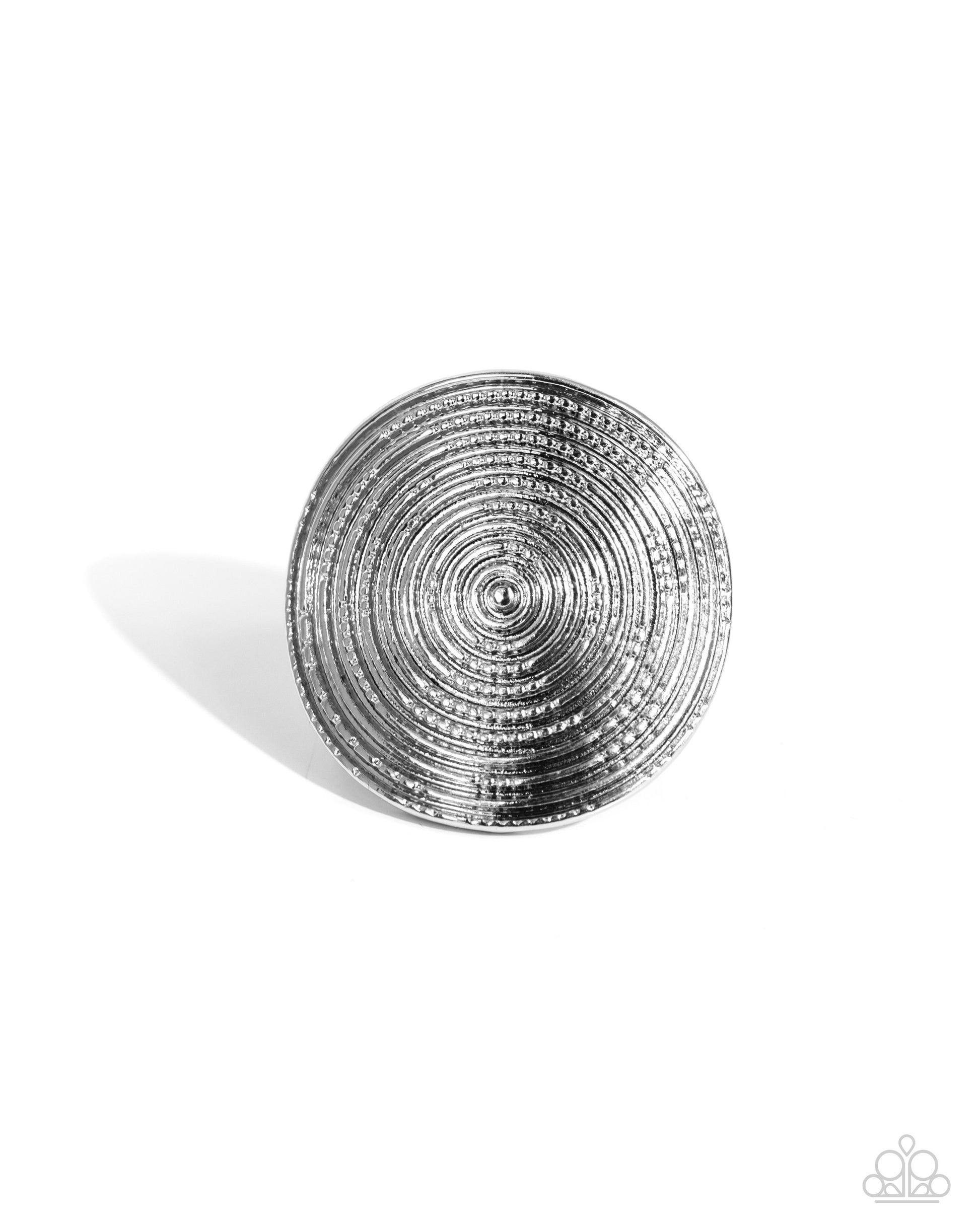 Featuring an understated dot motif, shimmery textured circles radiate into an oversized, dizzying, concaved silver frame atop the finger. Features a stretchy band for a flexible fit.  Sold as one individual ring.