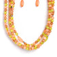 Paparazzi Accessories - Layered Lass - Multi Necklaces varying in shape and color, a collection of milky round and oval Peach Pink, Leek Green, and Macchiato beads are threaded along invisible wires below the collar. Shiny silver cube beads are sprinkled throughout the strands, adding hints of shimmer to the vibrant layers. Features an adjustable clasp closure.   Sold as one individual necklace. Includes one pair of matching earrings.