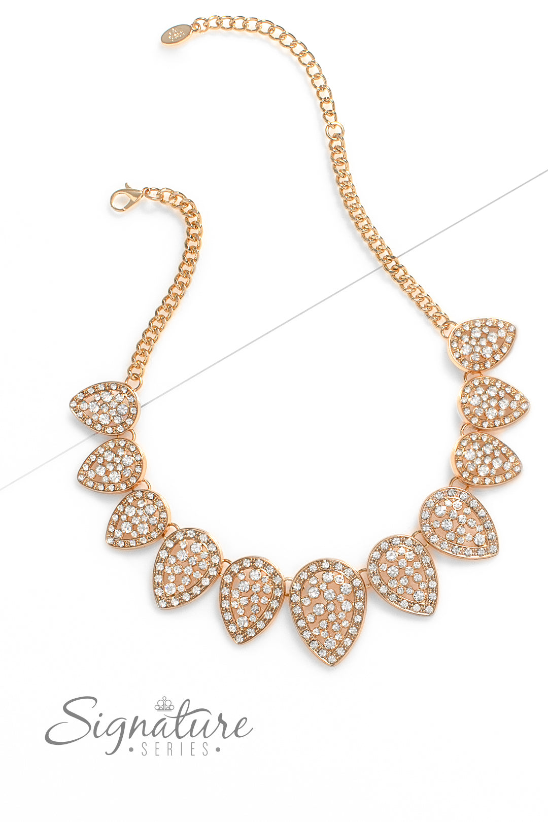 Gold teardrops are dusted in white rhinestones and flipped upside down, fanning out along the collar in a glittery display. Increasing in size as they lead to the center, each teardrop sparkles intensely, showcasing its pristine borders and dramatic dazzle. Features an adjustable clasp closure.  Sold as one individual necklace. Includes one pair of matching earrings.