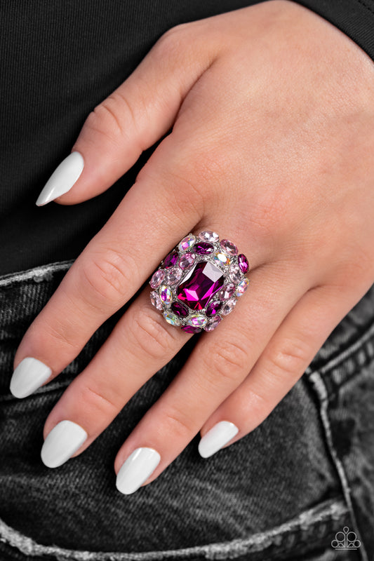 Paparazzi Accessories - Perfectly Park Avenue - Pink Rings faceted radiant-cut fuchsia gem is pressed into an elaborate silver frame filled with blinding oval-cut gems in varying shades and opacities of pink gems for a dynamically colorful statement atop the finger. Features a stretchy band for a flexible fit. Due to its prismatic palette, color may vary.  Sold as one individual ring.