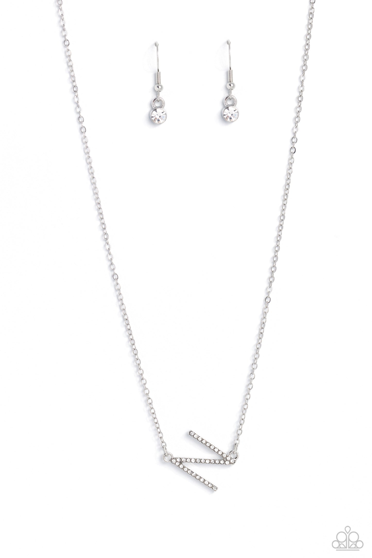 Paparazzi Accessories - Initially Yours - N White Necklaces embossed with dainty white rhinestones, a silver letter "N" hovers below the collar from a dainty silver chain, for a sentimentally simple design. Features an adjustable clasp closure.  Sold as one individual necklace. Includes one pair of matching earrings.