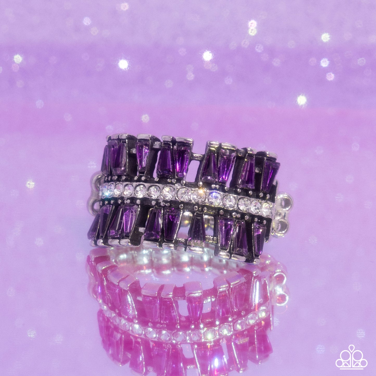Paparazzi Accessories - Staggering Stacks - Purple Rings staggered rows of emerald-cut purple rhinestones flare out from the top and bottom of a row of classic white rhinestones, creating a smoldering statement piece atop the finger. Features a stretchy band for a flexible fit. Sold as one individual ring.
