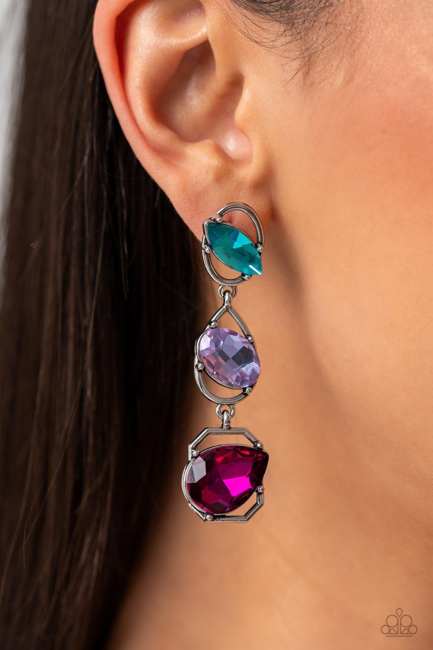 Paparazzi Accessories - Dimensional Dance - Multi Earrings linking together to create a geometric lure, a sleek silver oval, teardrop, and emerald-cut frame cascade down the ear. Slanted sideways in pronged settings across each frame, a fuchsia teardrop, purple oval-cut, and aquamarine marquise-cut gem create a gorgeous pop of color against the thin edgy frames. Earring attaches to a standard post fitting.  Sold as one pair of post earrings.
