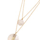 Paparazzi Accessories - Striped Style - White Necklaces two strands of classic gold chains fall into tiered layers as they cascade down the chest. Varying sizes of gold discs hammered in rippling texture and painted with a glossy white slide along each chain in a dizzying display, with a thin line of gold peeking at the center of the lowermost exaggerated pendant.  Sold as one individual necklace. Includes one pair of matching earrings.