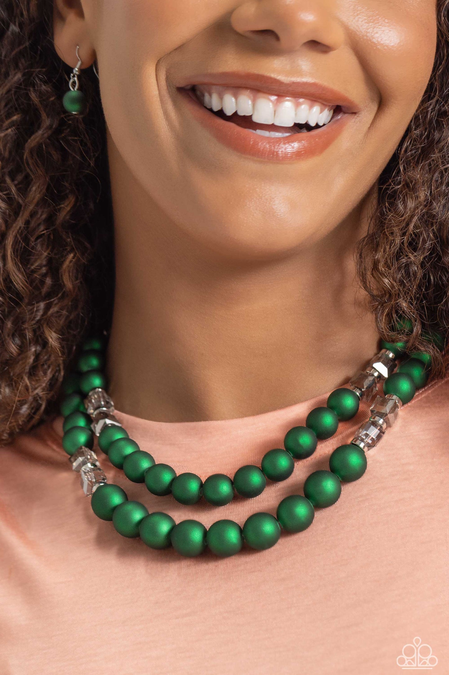 Paparazzi Accessories - Shopaholic Season & Shopaholic Showdown - Green Set two rows of oversized emerald green beads featuring a subtle shimmer, silver accents, and clear gray cubed beads fall below the collar on silver paperclip chains, creating refined, colorful layers. Features an adjustable clasp closure.  Sold as one individual necklace. Includes one pair of matching earrings.
