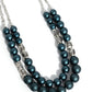 Paparazzi Accessories - Shopaholic Season and Shopaholic Showdown - Blue Jewelry Sets two rows of oversized blue beads featuring a subtle shimmer, silver accents, and clear gray cubed beads fall below the collar on silver paperclip chains, creating refined, colorful layers. Features an adjustable clasp closure.  Sold as one individual necklace. Includes one pair of matching earrings.  Get The Complete Look!