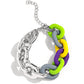 Paparazzi Accessories - Contrasting Couture & Candid Contrast - Silver Jewelry Set a strand of oversized silver curb chain collides with purple, High Visibility, Kohlrabi, and Ultimate Gray acrylic curb links to create an abstract blend of grit and color. The oversized links of the colored curb chain offset the high sheen of the silver that lays on the opposite side, perfectly balancing the contrasting design. Features an adjustable clasp closure. Sold as one individual choker necklace.